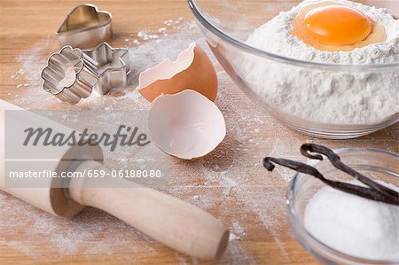 Assorted baking ingredients, cookie cutters and rolling pin