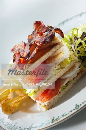 A club sandwich with egg and vegetables