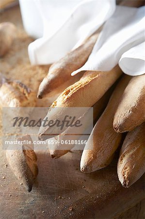 Baguettes with White Napkins on a Cutting Board