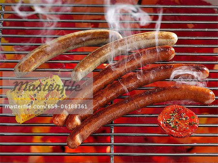 Smoking sausages on a grill Smoking sausages on a grill