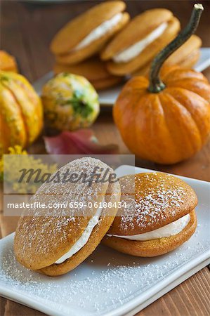 Two Pumpkin Whoopie Pies with Powdered Sugar; Gourds