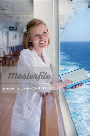 Teenage Girl Reading Book on Cruise Ship