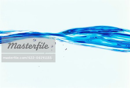 Blue Splashing Water On White, Close-Up Blue Splashing Water On White, Close-Up