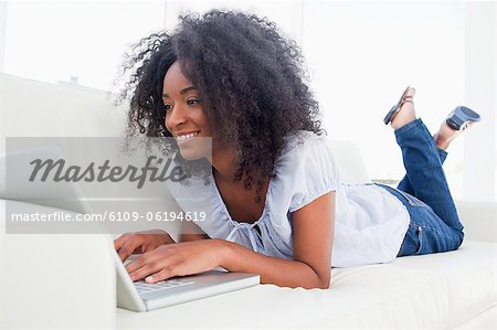 Cute fuzzy hair woman surfing the internet