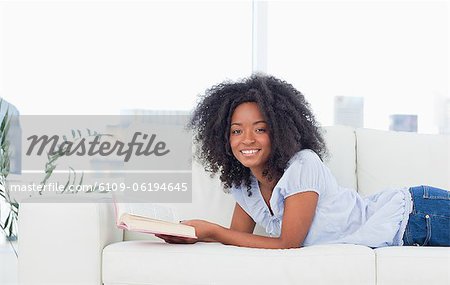 Portrait of a happy  woman holding a book