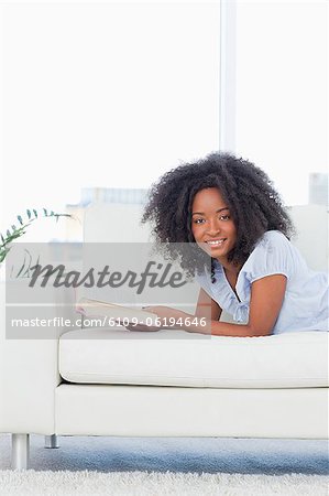 Portrait of a cute  woman reading a book