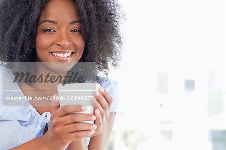 Portrait of a woman holding a cup of hot chocolate