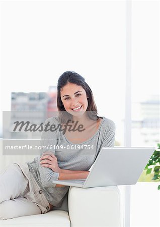 Portrait of a young woman using a personal computer