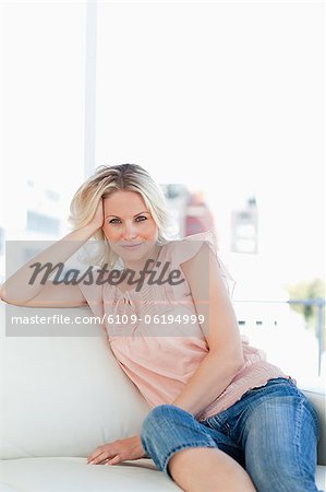 Portrait of an attractive blonde in a living room