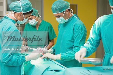 View of surgeons using surgical tools