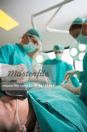 Focus on a patient lying on an operating table