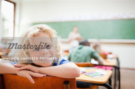 Elementary school student not paying attention to lesson