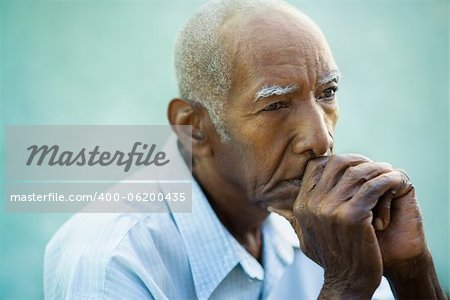 Seniors portrait of contemplative old african american man looking away. Copy space