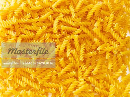 Pile of pasta spread out on a surface