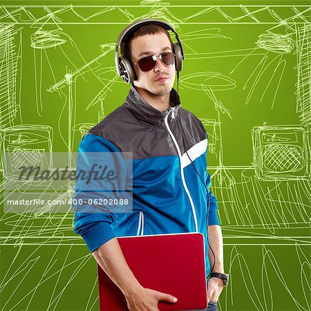 Man with headphones and laptop, listening to the music