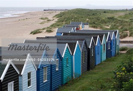 Beach huts on Southwold Beach looking towards Sizewell, Suffolk, England