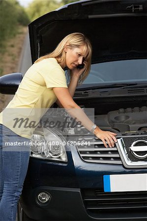 Female Driver Broken Down On Country Road