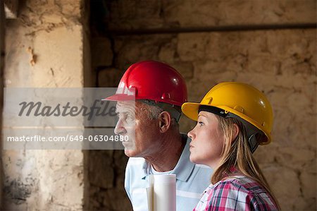 Construction workers standing on site