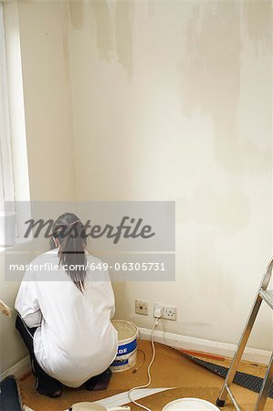 Woman painting room