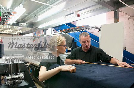 Workers talking in garment factory