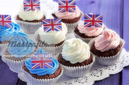 Chocolate cupcakes decorated with coloured cream and Union Jacks