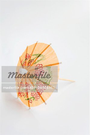 An orange cocktail umbrella