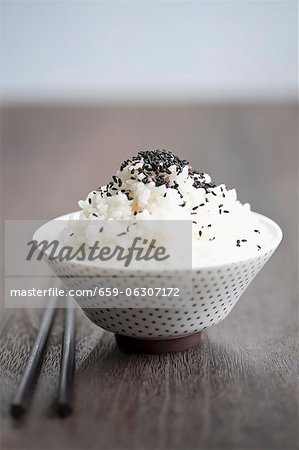 A bowl of rice with black sesame seeds