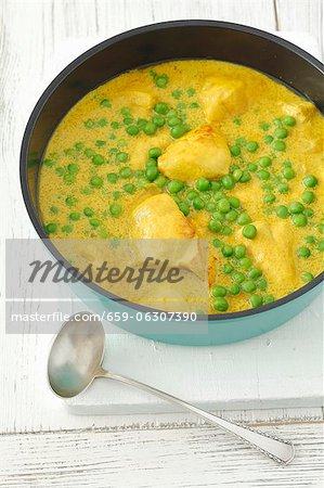 Chicken breast in curry sauce with peas