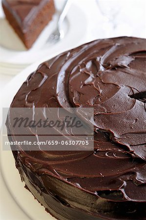 A chocolate cake topped with ganache