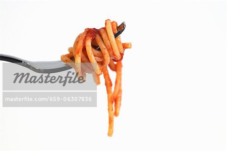 A fork of spaghetti with tomato sauce