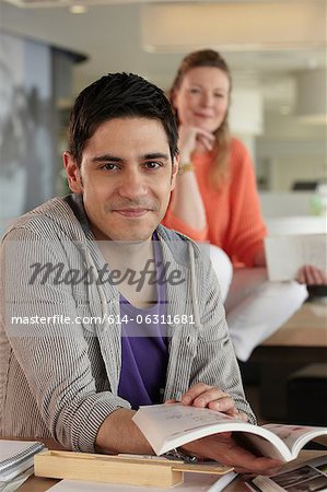 Man holding book, portrait