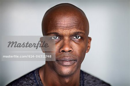 Portrait of a bald man looking at camera
