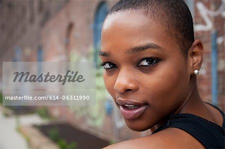 Portrait of a young woman with shaved head Portrait of a young woman with shaved head