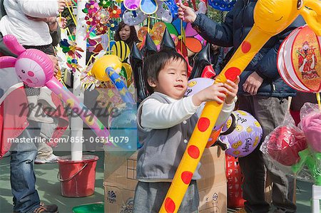 Boys playing with the balloons at the fllower market, Tsuen Wan, Hong Kong