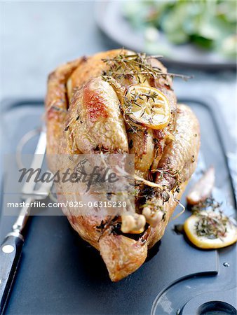 Roast guinea-fowl with lemon and herbs