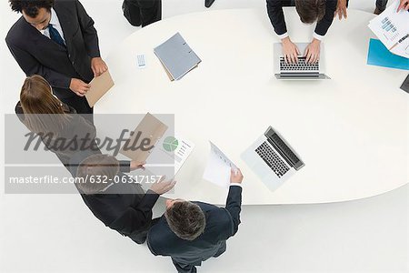 Business associates working together reviewing document