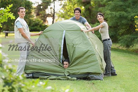 Young campers camping on field