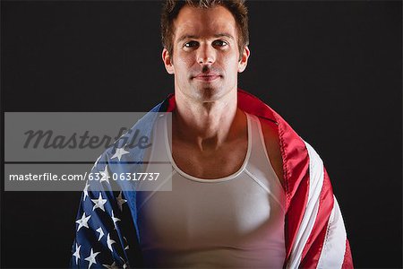 Athlete covered with American flag, portrait