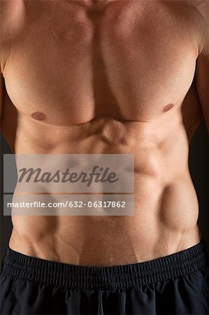 Barechested muscular man, mid section