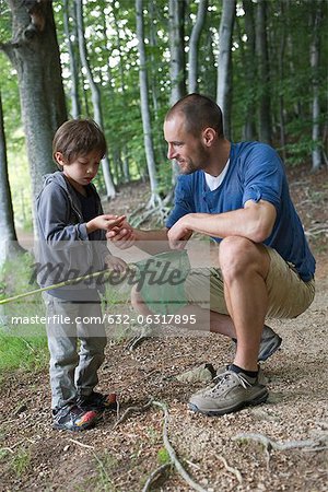 Father and son in woods