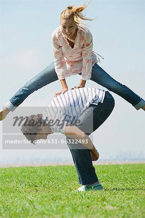 Mature couple playing leapfrog