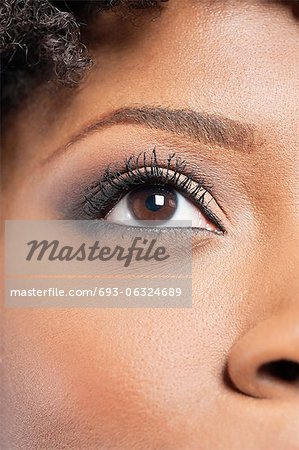 Cropped image of African American woman with eye makeup