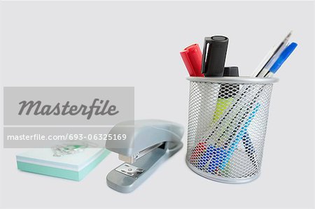 Close-up of office supplies over white background