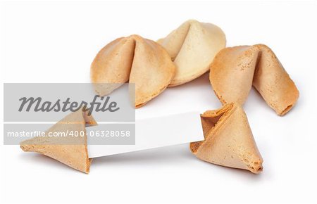 A fortune cookie with fortune paper in front of a few other cookies isolated on white.