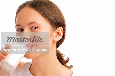 Portrait of beautiful young woman drinking milk
