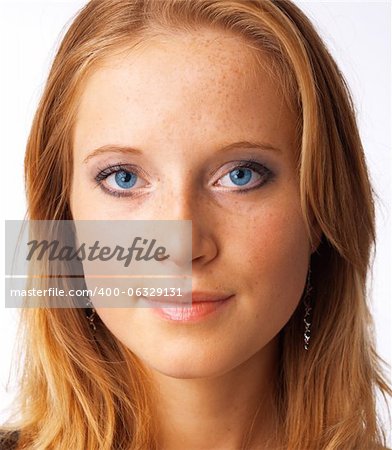 Close-up portrait of a beautiful young blue-eyed model.