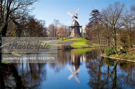 windmill and it's reflection in lake in Bremen, Germany