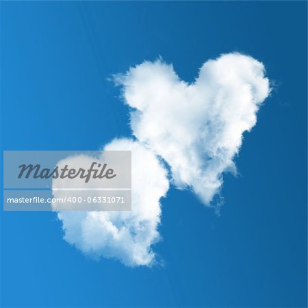 Two heart-shaped clouds on blue sky background.  Valentine's Day