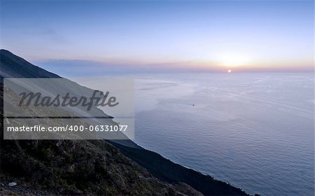 The foot of Mount Stromboli and the sunset over the sea