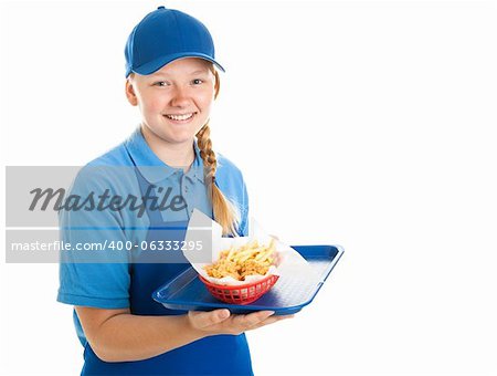 Teenage fast food worker holding a tray of chicken nuggets and fries.  Isolated on white.